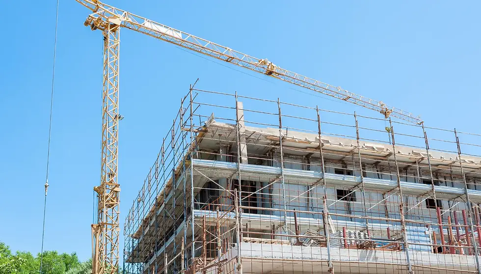 Commercial building under reconstruction with scaffolding, showcasing materials and structural rebuild costs