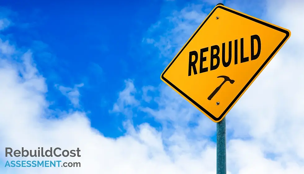 Rebuild sign with hammer symbol against a clear blue sky, illustrating the importance of building insurance for mortgage purposes.